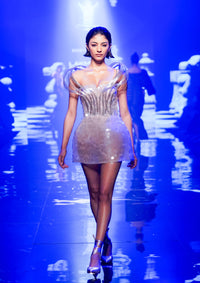 Clover In Statement Shoulders And A Shimmery Bodice